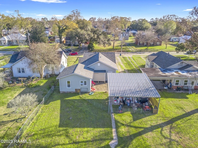 birds eye view of property with a residential view