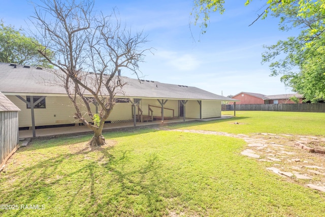 view of yard featuring a patio area and fence