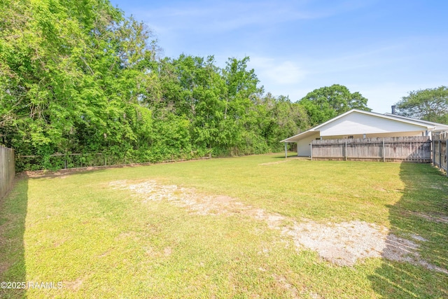 view of yard featuring a fenced backyard
