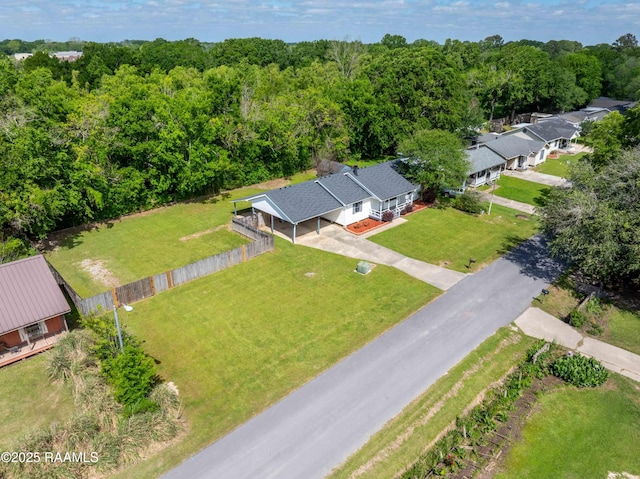 drone / aerial view featuring a view of trees