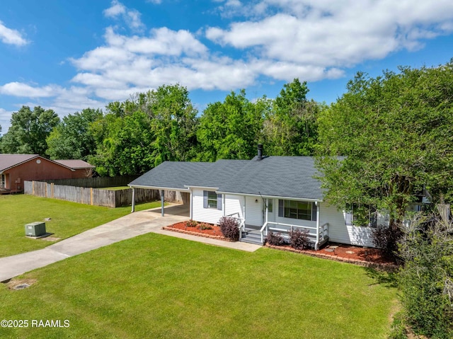 view of front of property with a carport, covered porch, fence, a front lawn, and driveway