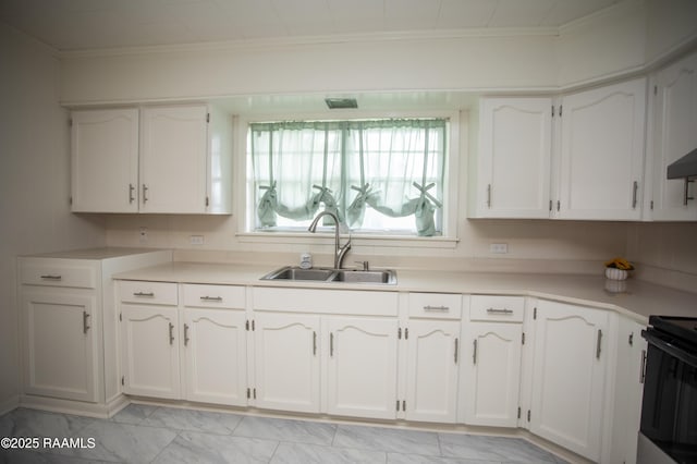 4189 Poydras Hwy, Breaux Bridge, LA 70517 - kitchen with white cabinets, a sink, light countertops, and crown molding