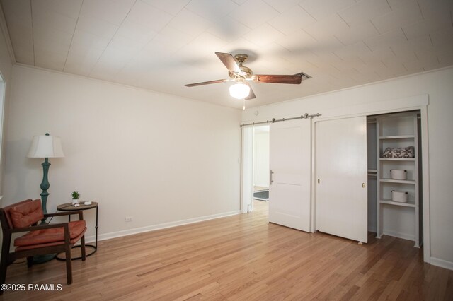 4189 Poydras Hwy, Breaux Bridge, LA 70517 - living area featuring baseboards, light wood-type flooring, ceiling fan, and ornamental molding