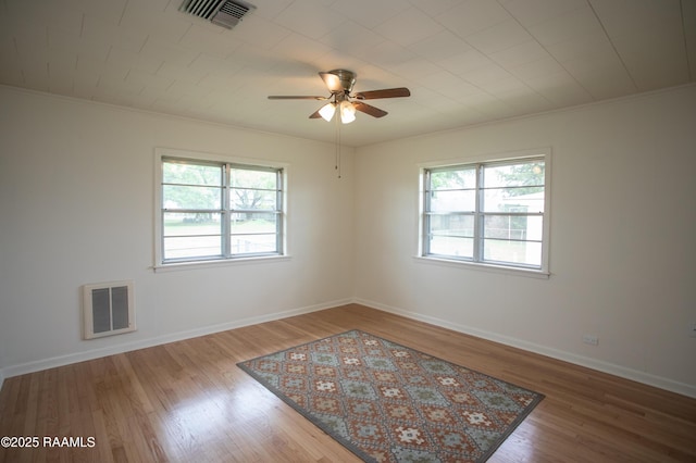 4189 Poydras Hwy, Breaux Bridge, LA 70517 - spare room with wood finished floors, plenty of natural light, and visible vents