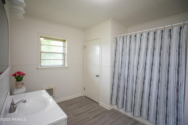 4189 Poydras Hwy, Breaux Bridge, LA 70517 - bathroom with vanity, ornamental molding, wood finish floors, and curtained shower