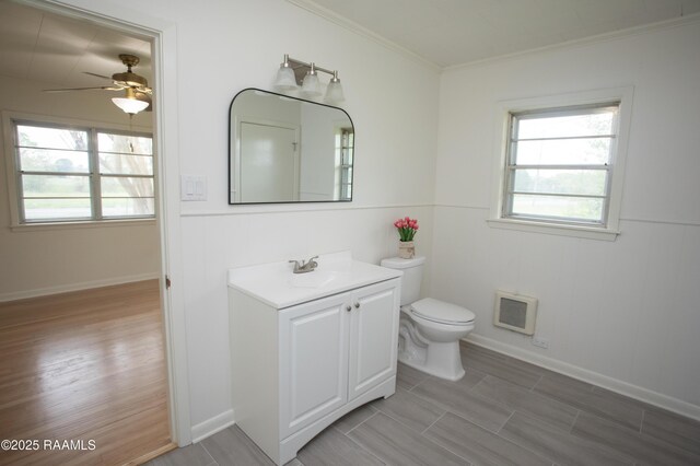 4189 Poydras Hwy, Breaux Bridge, LA 70517 - bathroom featuring a wealth of natural light, toilet, ceiling fan, and vanity