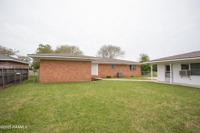4189 Poydras Hwy, Breaux Bridge, LA 70517 - back of property with fence, crawl space, brick siding, cooling unit, and a yard