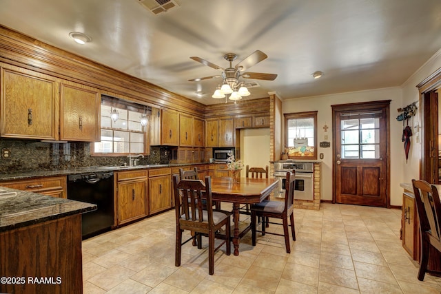 1217 Wellington Ave, Opelousas, LA 70570 - kitchen with a sink, brown cabinetry, visible vents, ceiling fan, and appliances with stainless steel finishes