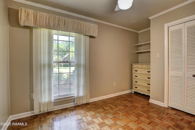 1217 Wellington Ave, Opelousas, LA 70570 - unfurnished bedroom featuring crown molding, a closet, multiple windows, and baseboards