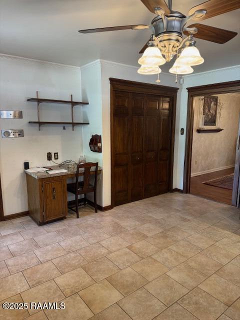1217 Wellington Ave, Opelousas, LA 70570 - entrance foyer with crown molding, baseboards, and ceiling fan with notable chandelier