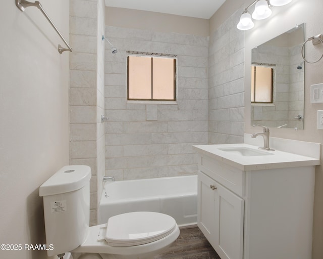 full bathroom featuring toilet, vanity,  shower combination, and wood finished floors