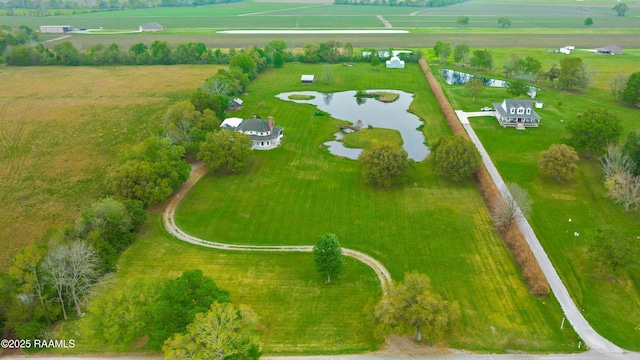 drone / aerial view with a water view and a rural view