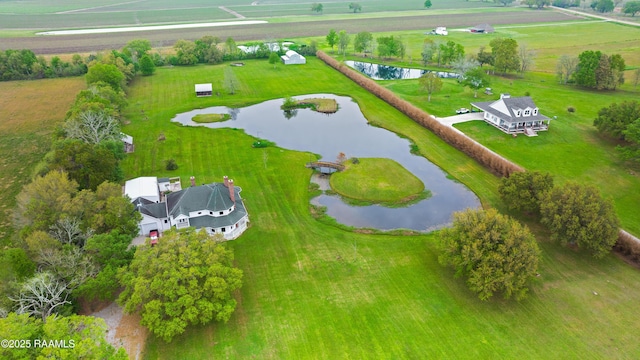 aerial view with a rural view and a water view