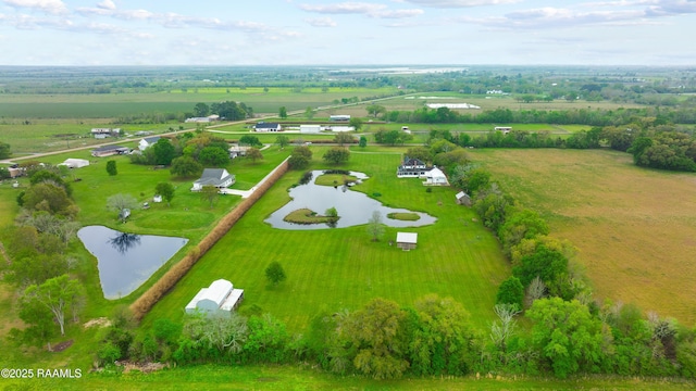 birds eye view of property with a rural view and a water view