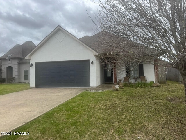 114 Sandhill Crane Dr, Lafayette, LA 70508 - single story home with an attached garage, brick siding, concrete driveway, and a front yard