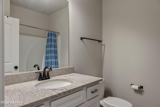 full bathroom with vanity, toilet, and a shower with shower curtain