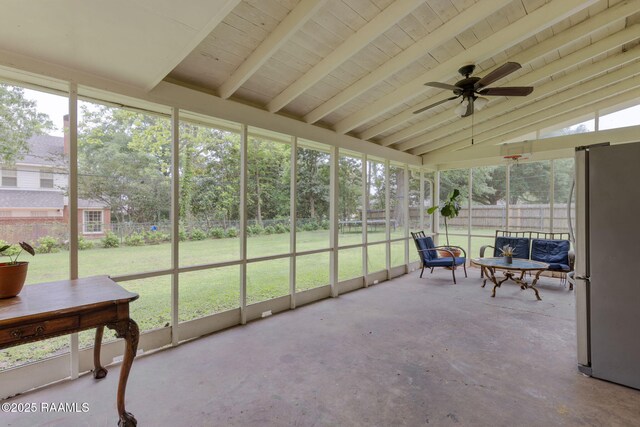 sunroom with beamed ceiling and ceiling fan