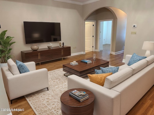 403 S Montauban Dr, Lafayette, LA 70507 - living room with wood finished floors, crown molding, and arched walkways