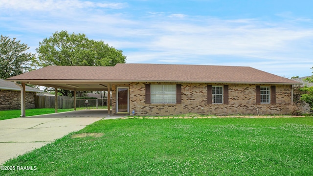 1406 S Patout St, New Iberia, LA 70560 - ranch-style house with fence, a front yard, brick siding, concrete driveway, and a carport