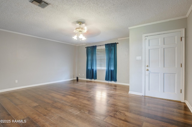1406 S Patout St, New Iberia, LA 70560 - empty room featuring ceiling fan, a textured ceiling, visible vents, crown molding, and wood finished floors