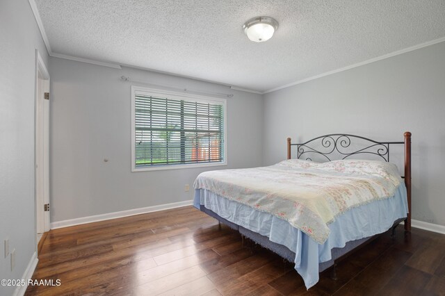 1406 S Patout St, New Iberia, LA 70560 - bedroom with ornamental molding, a textured ceiling, and wood finished floors