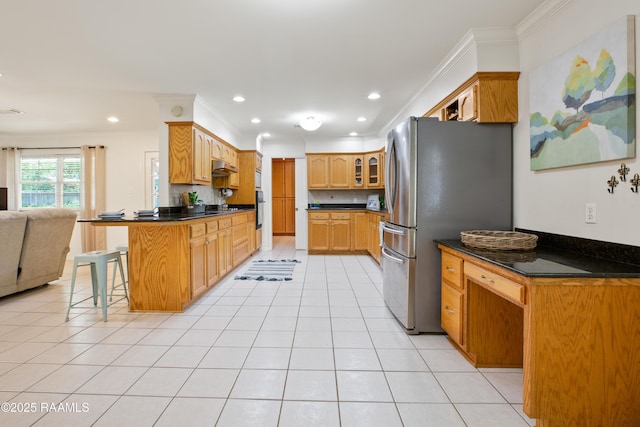 200 Sandager Ave, Jeanerette, LA 70544 - kitchen featuring open floor plan, a peninsula, freestanding refrigerator, crown molding, and dark countertops