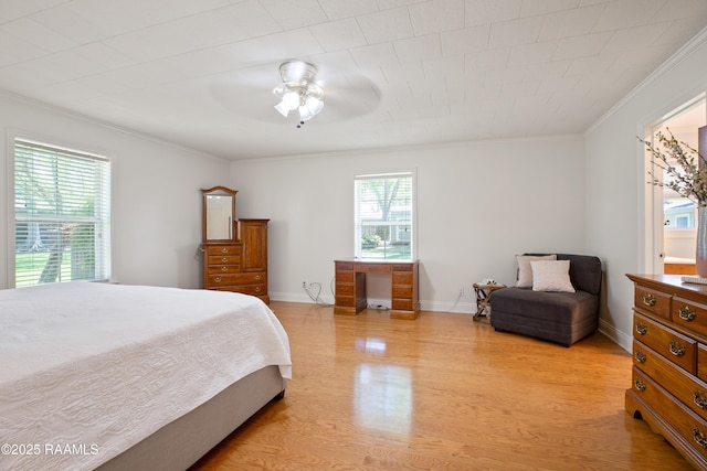 200 Sandager Ave, Jeanerette, LA 70544 - bedroom with light wood-type flooring, ceiling fan, baseboards, and ornamental molding