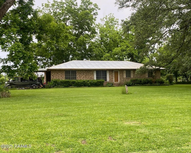 207 Menard Rd, Sunset, LA 70584 - ranch-style house featuring a front lawn