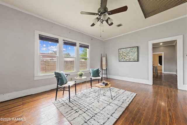 sitting room with visible vents, crown molding, baseboards, a ceiling fan, and hardwood / wood-style floors
