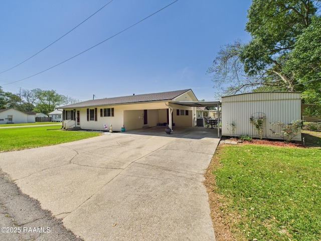 ranch-style house with a carport, driveway, and a front yard