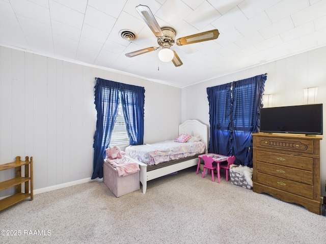 carpeted bedroom with baseboards, visible vents, ceiling fan, and crown molding