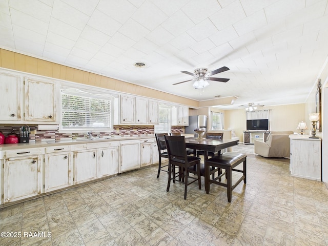 dining area with visible vents and ceiling fan