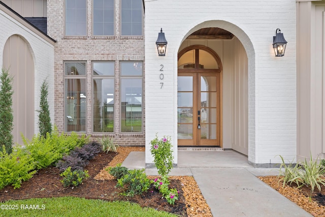 207 Sunset Palm Ct, Youngsville, LA 70592 - entrance to property with brick siding and french doors