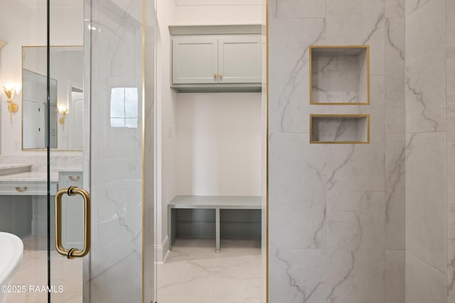 207 Sunset Palm Ct, Youngsville, LA 70592 - bathroom with marble finish floors, a marble finish shower, and vanity