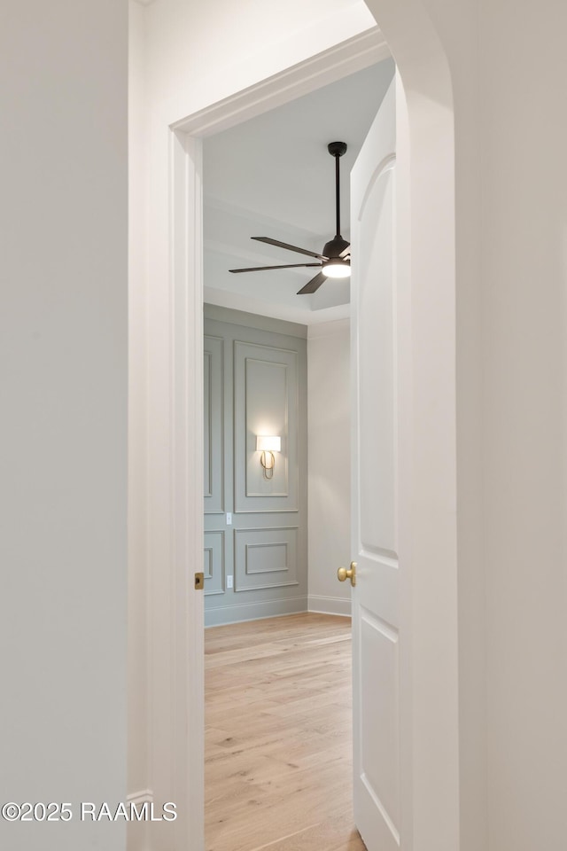 207 Sunset Palm Ct, Youngsville, LA 70592 - corridor featuring light wood finished floors and arched walkways