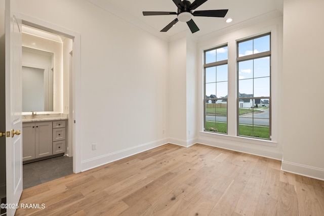 207 Sunset Palm Ct, Youngsville, LA 70592 - spare room featuring healthy amount of natural light, light wood-style floors, ceiling fan, ornamental molding, and recessed lighting