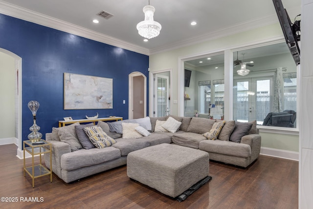 208 Woodstone Dr, Lafayette, LA 70508 - living area featuring visible vents, baseboards, arched walkways, and dark wood-style floors