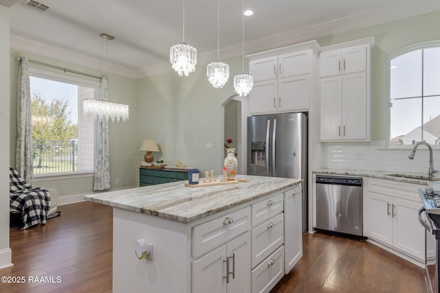 208 Woodstone Dr, Lafayette, LA 70508 - kitchen featuring a wealth of natural light, dark wood-style floors, a sink, and appliances with stainless steel finishes