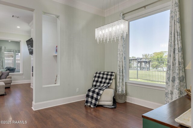 208 Woodstone Dr, Lafayette, LA 70508 - living area with a notable chandelier, baseboards, ornamental molding, and wood finished floors