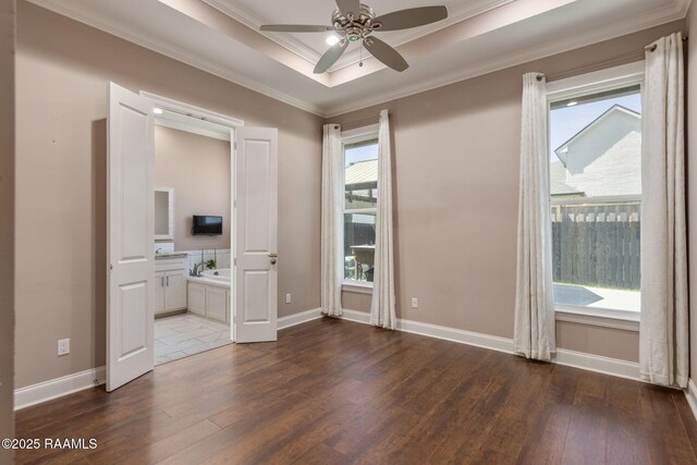 208 Woodstone Dr, Lafayette, LA 70508 - unfurnished bedroom with ornamental molding, baseboards, and hardwood / wood-style flooring
