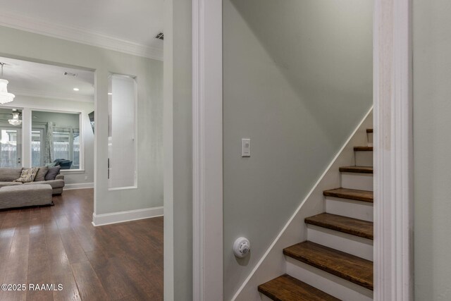 208 Woodstone Dr, Lafayette, LA 70508 - stairs featuring hardwood / wood-style floors, a notable chandelier, baseboards, and ornamental molding
