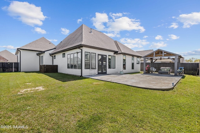 208 Woodstone Dr, Lafayette, LA 70508 - back of house with a patio area, a gazebo, a lawn, a fenced backyard, and roof with shingles