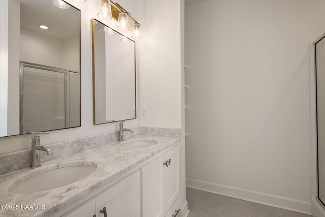 1510 Kaliste Saloom Unit 203, Lafayette, LA 70508 - bathroom with a shower with door, double vanity, baseboards, and a sink
