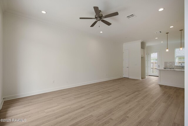 1510 Kaliste Saloom Unit 203, Lafayette, LA 70508 - unfurnished living room featuring ceiling fan, light wood-style flooring, ornamental molding, visible vents, and baseboards
