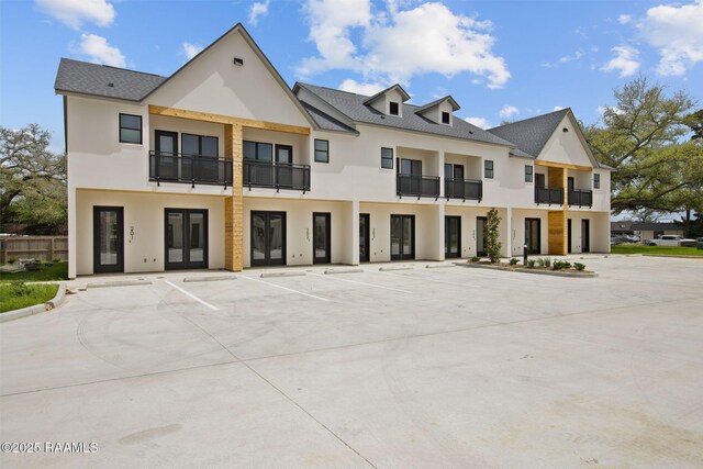 1510 Kaliste Saloom Unit 203, Lafayette, LA 70508 - view of building exterior with uncovered parking