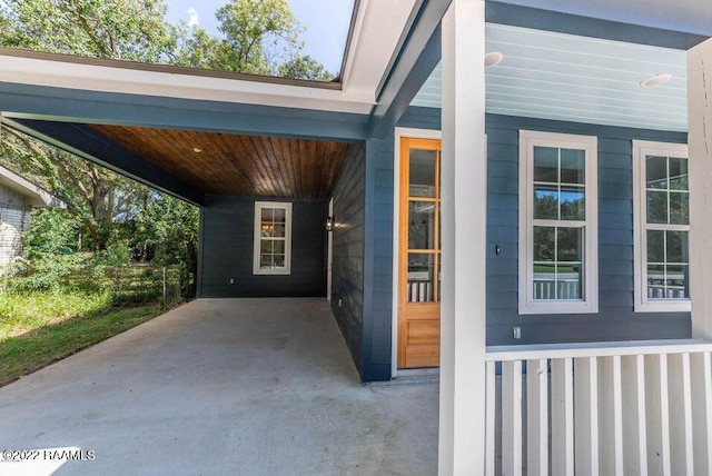 122 Rena Dr Unit A, Lafayette, LA 70503 - view of exterior entry featuring an attached carport