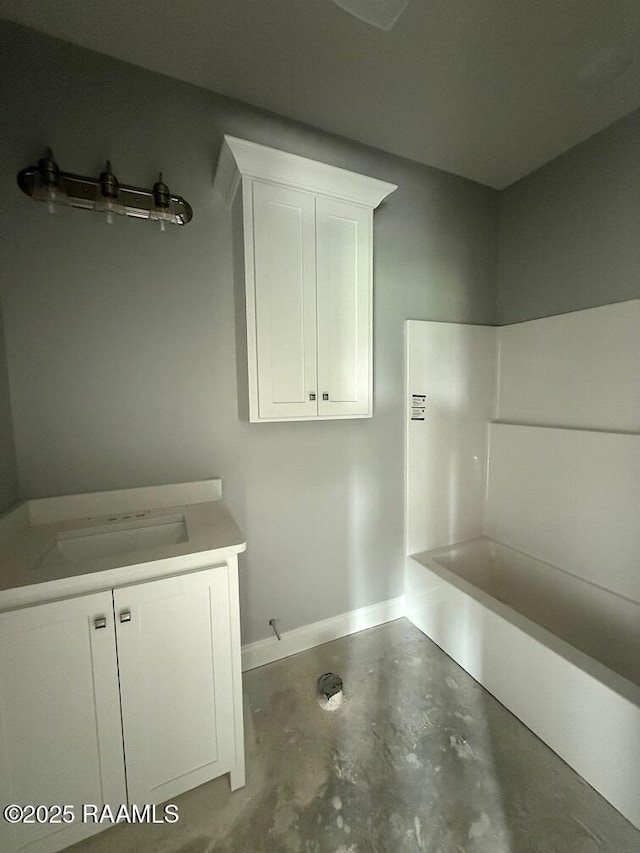 9923 Jimmie Rd, Kaplan, LA 70548 - full bath with concrete floors, vanity, and a bath