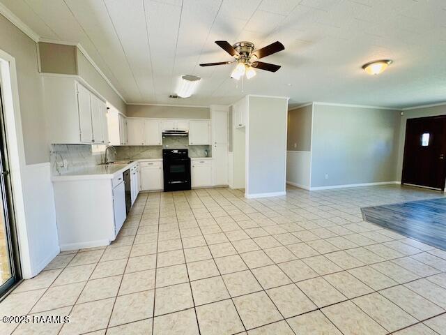 336 Harmon Ln, Opelousas, LA 70570 - kitchen with stove, a sink, light countertops, crown molding, and a ceiling fan
