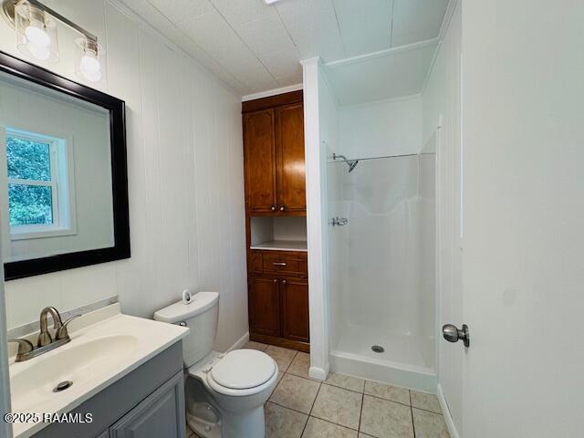 336 Harmon Ln, Opelousas, LA 70570 - bathroom with vanity, a stall shower, toilet, tile patterned flooring, and crown molding