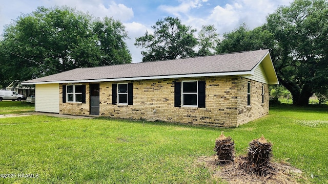 336 Harmon Ln, Opelousas, LA 70570 - ranch-style house featuring a front yard, brick siding, and roof with shingles